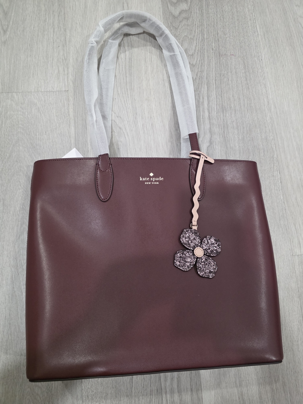 kate spade New York Maroon Leather Tote with Flower Charm